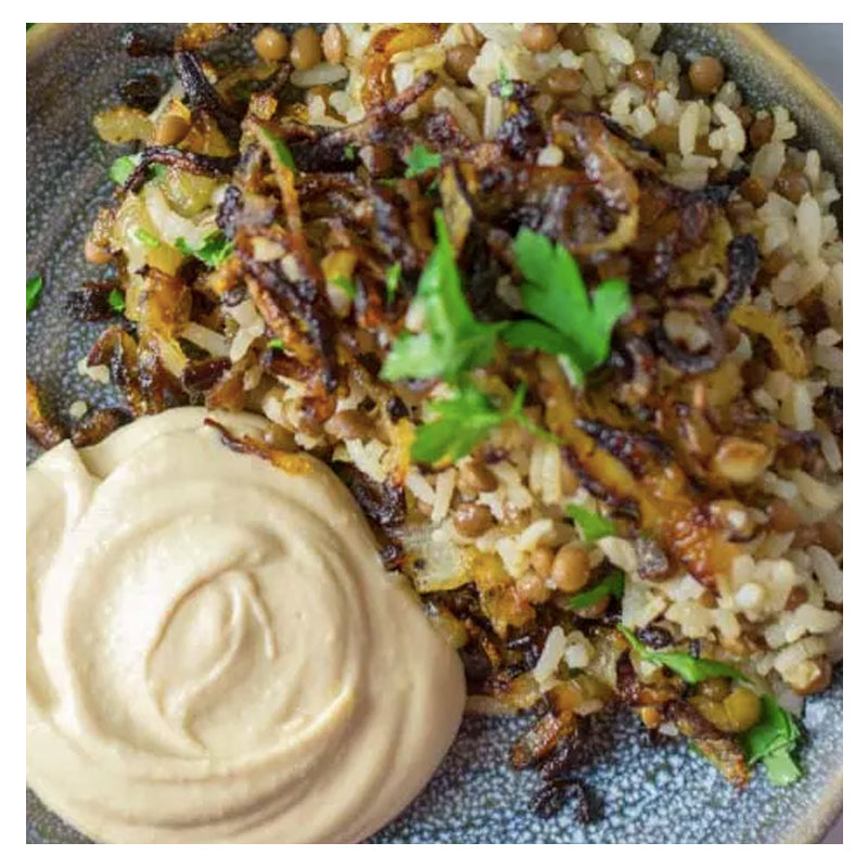 Try Tayybeh's Vegan Power Meal, which includes rice pilaf and lentils topped with caramelized onions and parsley, accompanied by a swirl of hummus.